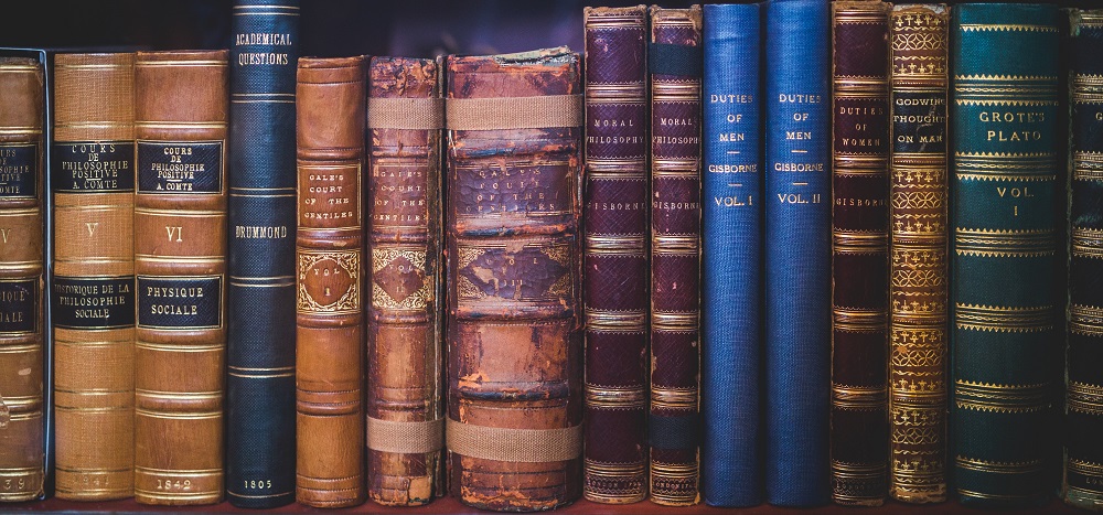 Photo of a shelf full of old books